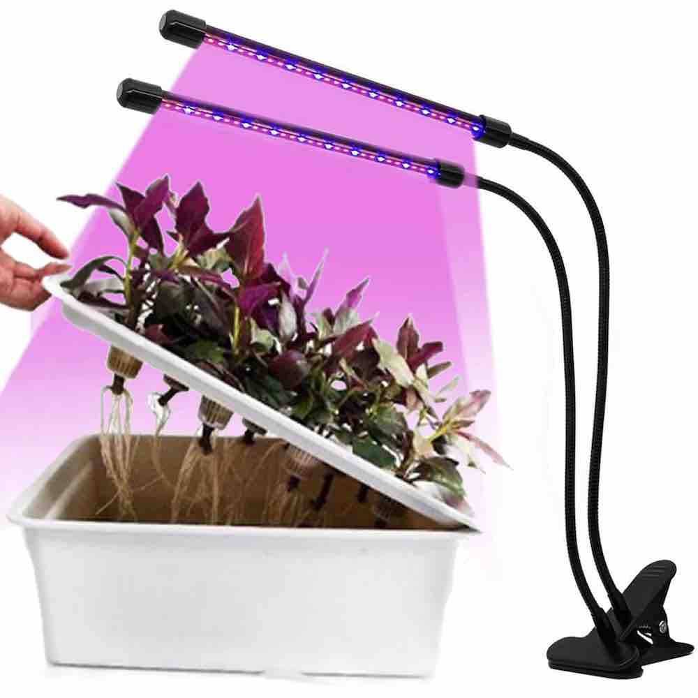 A dual head LED grow light on a gooseneck clip